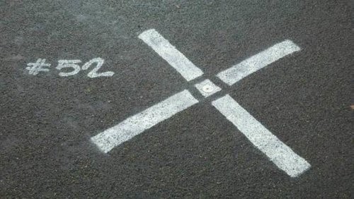 This is an example of a high quality GCP target spray painted onto the ground using a rectangular stencil.